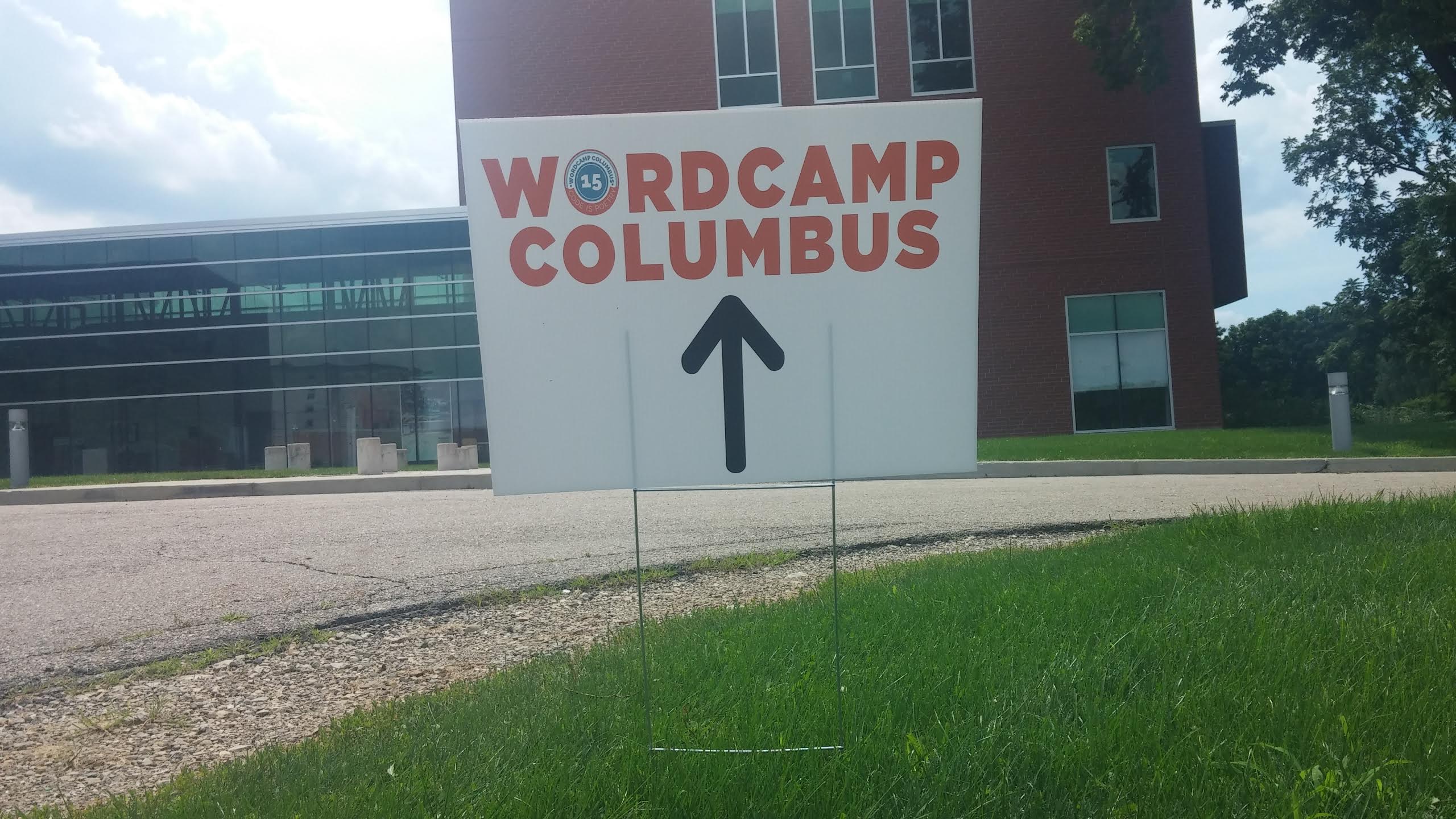 A directional sign pointing to the building where WordCamp Columbus 2015 takes place