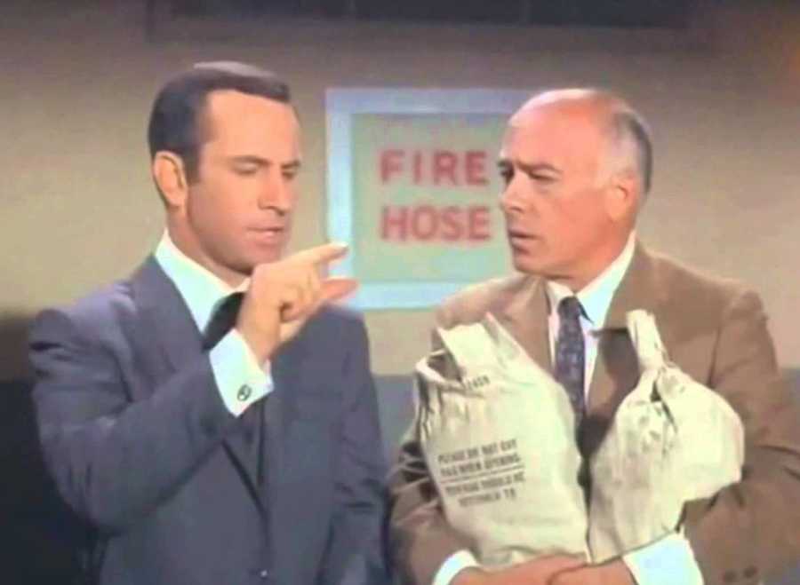 Agent Smart (Get Smart TV show) holding up his fingers just slightly separated, which he did every time he said 'Missed it by that much'