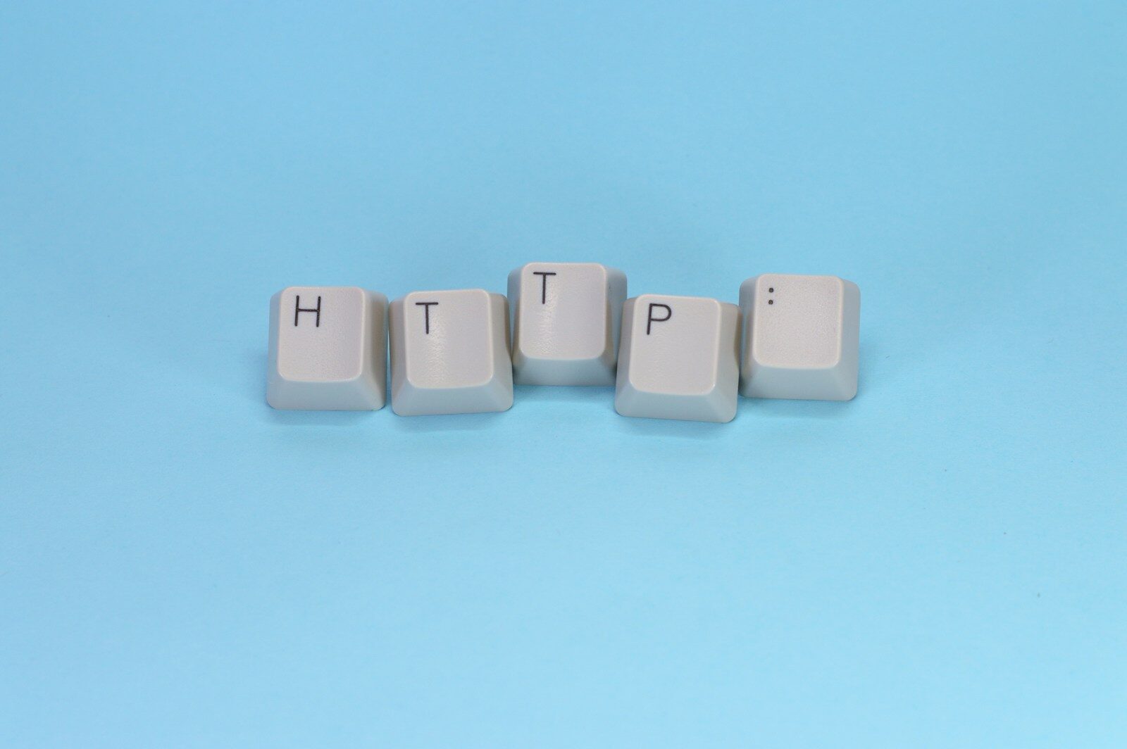 Keys spell out "http" on a blue background.